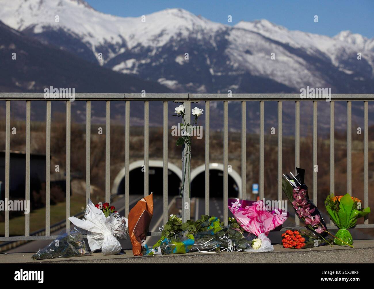 Floral tributes stand on a walkway in front of the Tunnel de Sierre in  which late Tuesday a bus crashed, in Sierre western Switzerland March 14,  2012. A bus carrying a Belgian