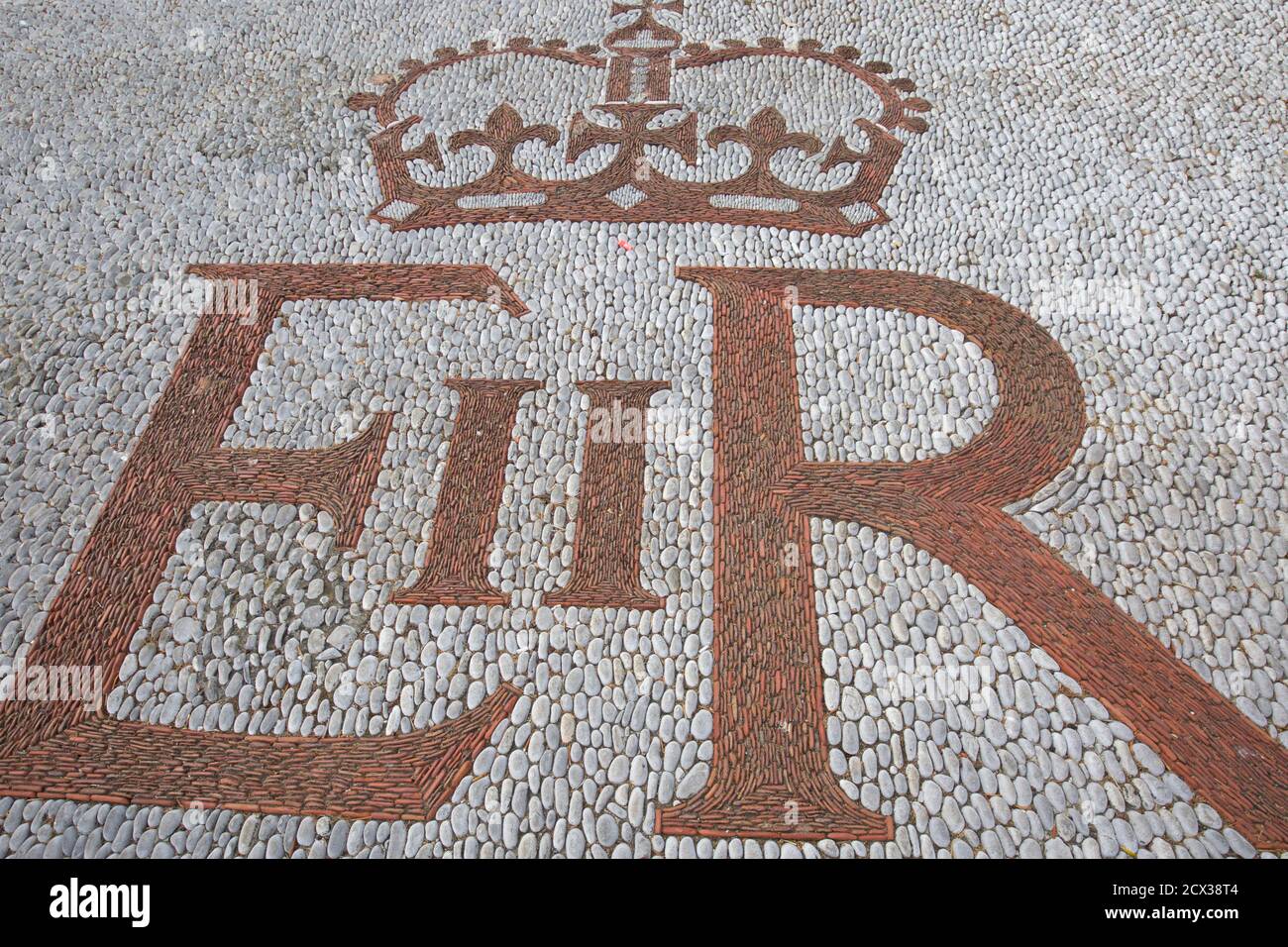 Queen Elizabeth II text on a cobble road in Gibraltar Stock Photo