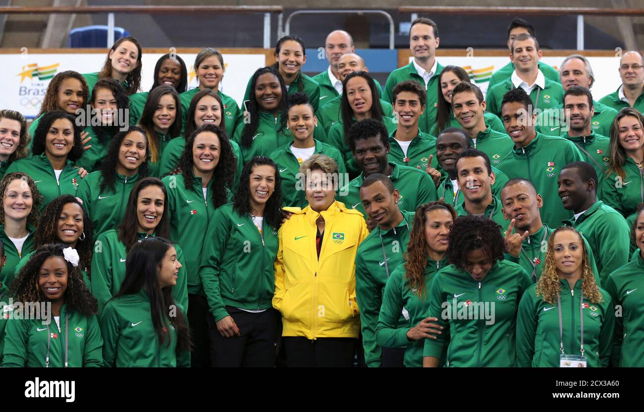 Brazil's President Dilma Rousseff (C) poses for a picture with Brazilian Olympic athletes at the Crystal Palace sports centre in London, July 27, 2012. Rousseff is visiting to attend the opening ceremony of the London 2012 Olympic Games. REUTERS/Sergio Moraes (BRITAIN - Tags: SPORT OLYMPICS POLITICS) Stock Photo