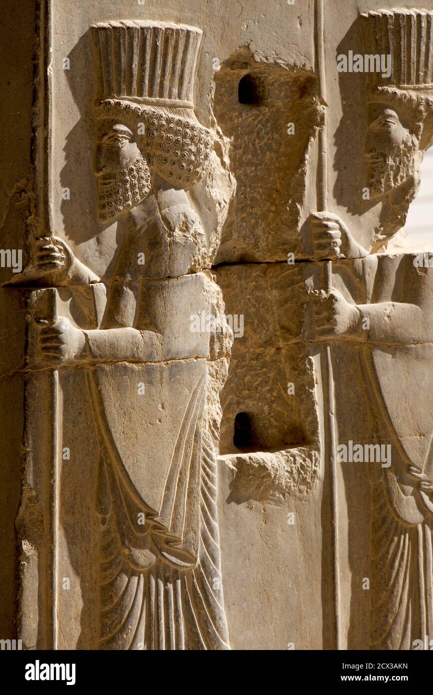 Apadana palace ruins and bas reliefs. Persian warriors. Persepolis ...