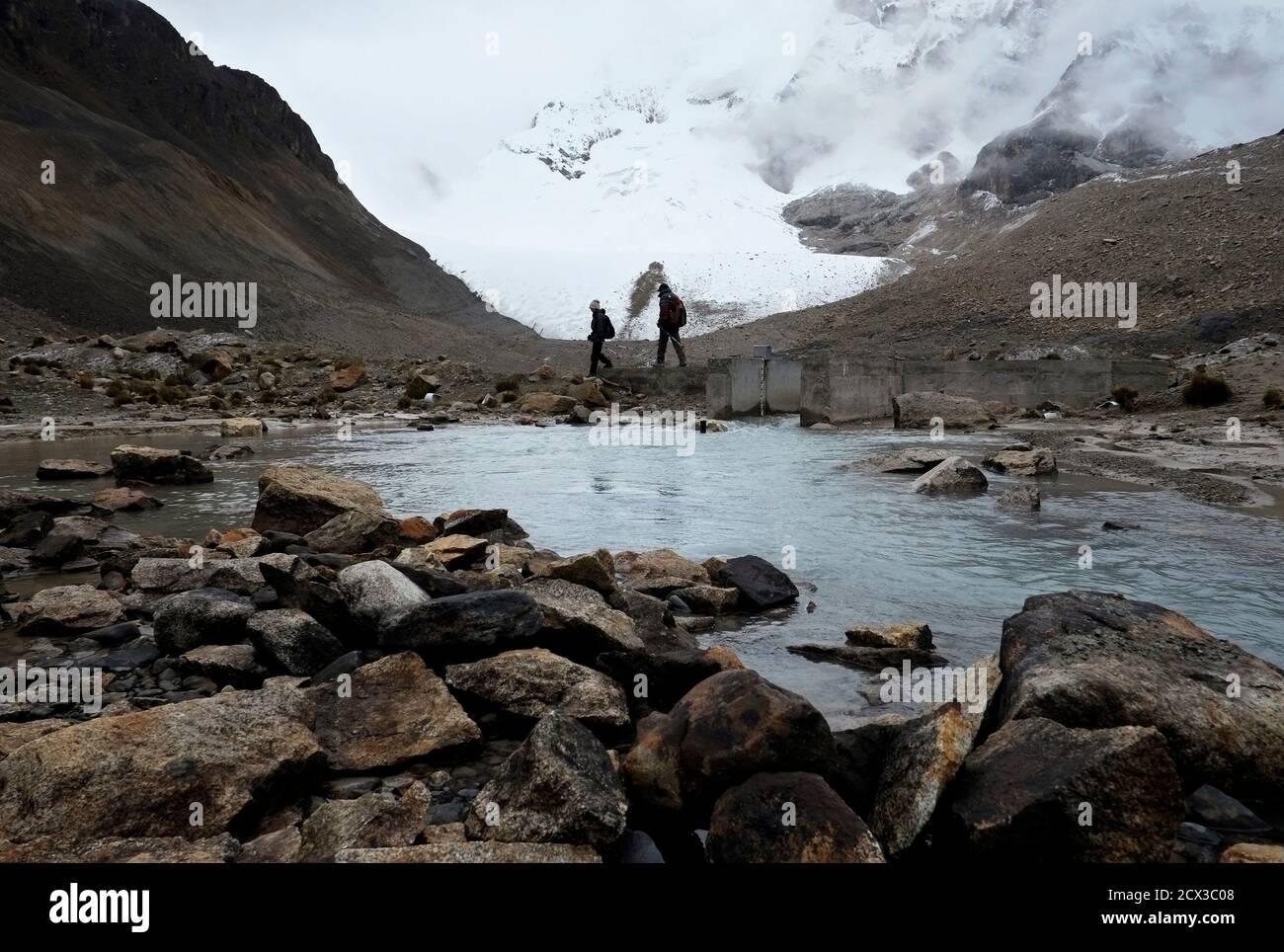 Scientists Walk Along The West Flank Of The Huayna Potosi Mountain Some 27 Km 17 Miles Northwest Of La Paz January 29 13 Japanese And Bolivian Scientists Are Studying The Shrinking Of