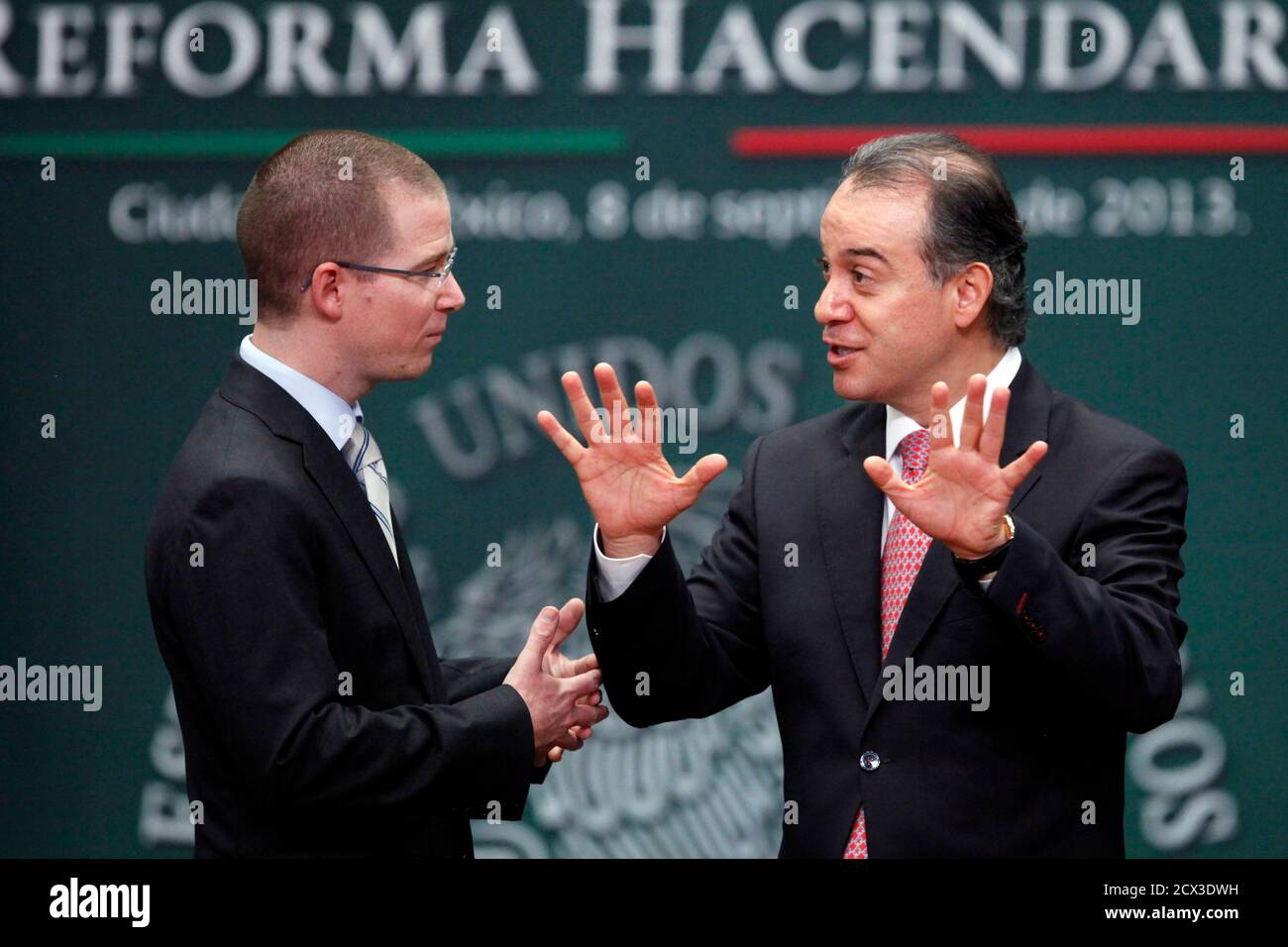 President of Mexico's Congress Ricardo Anaya (L) speaks with President of Mexico's Senate Raul Cervantes during the presentation of the fiscal reform at Los Pinos presidential residence in Mexico City, September 8, 2013. Mexico's government unveiled on Sunday a plan to increase taxes on higher income earners and levy a charge on stock market gains but shied away from widening a controversial sales tax amid an economic slowdown. The proposed reform will also include a universal pension, unemployment insurance and other measures to help the poor, who account for nearly half of the population, as Stock Photo