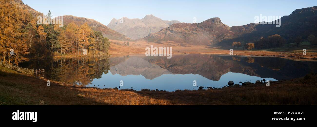 An autumnal view of the Langdale Pikes and Side Pike reflected in Blea Tarn, in the English Lake District Stock Photo