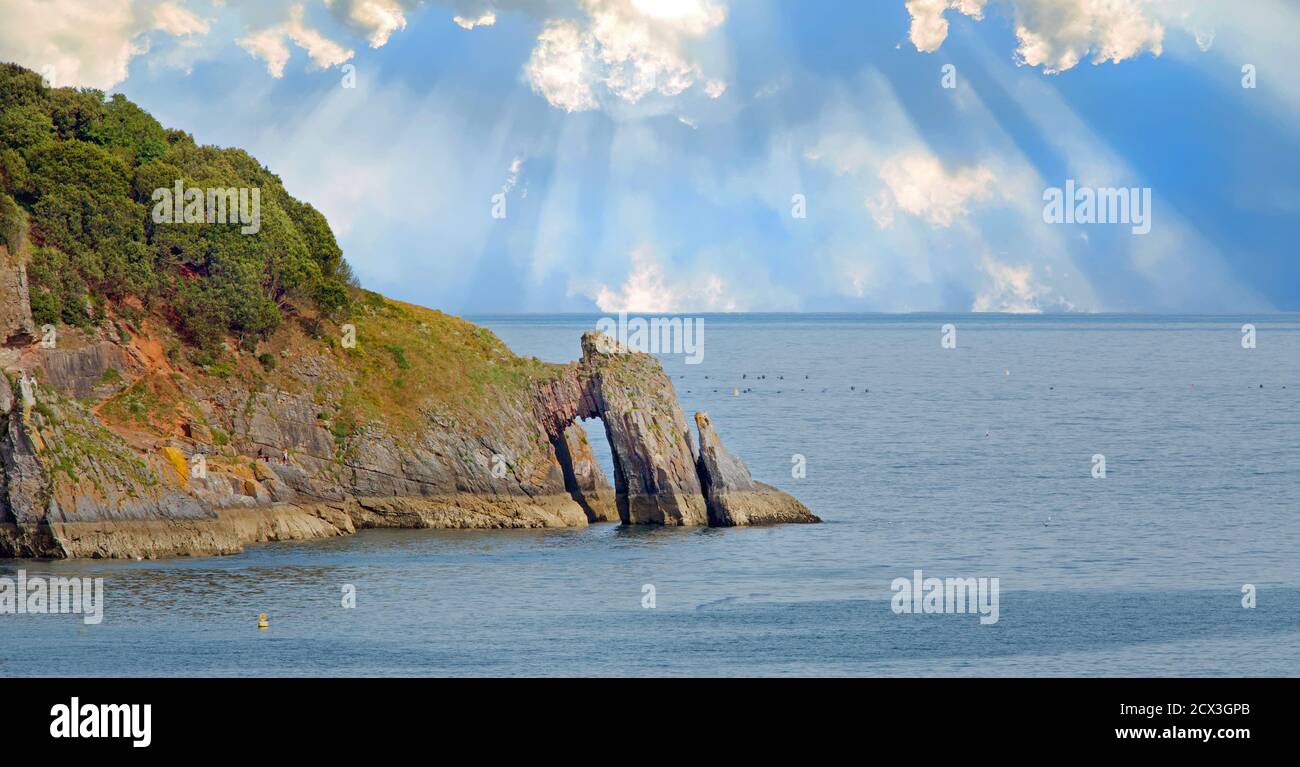 Daddy Hole Rock - A natural Arch formd by the sea in  Torquay, Devon, England Stock Photo
