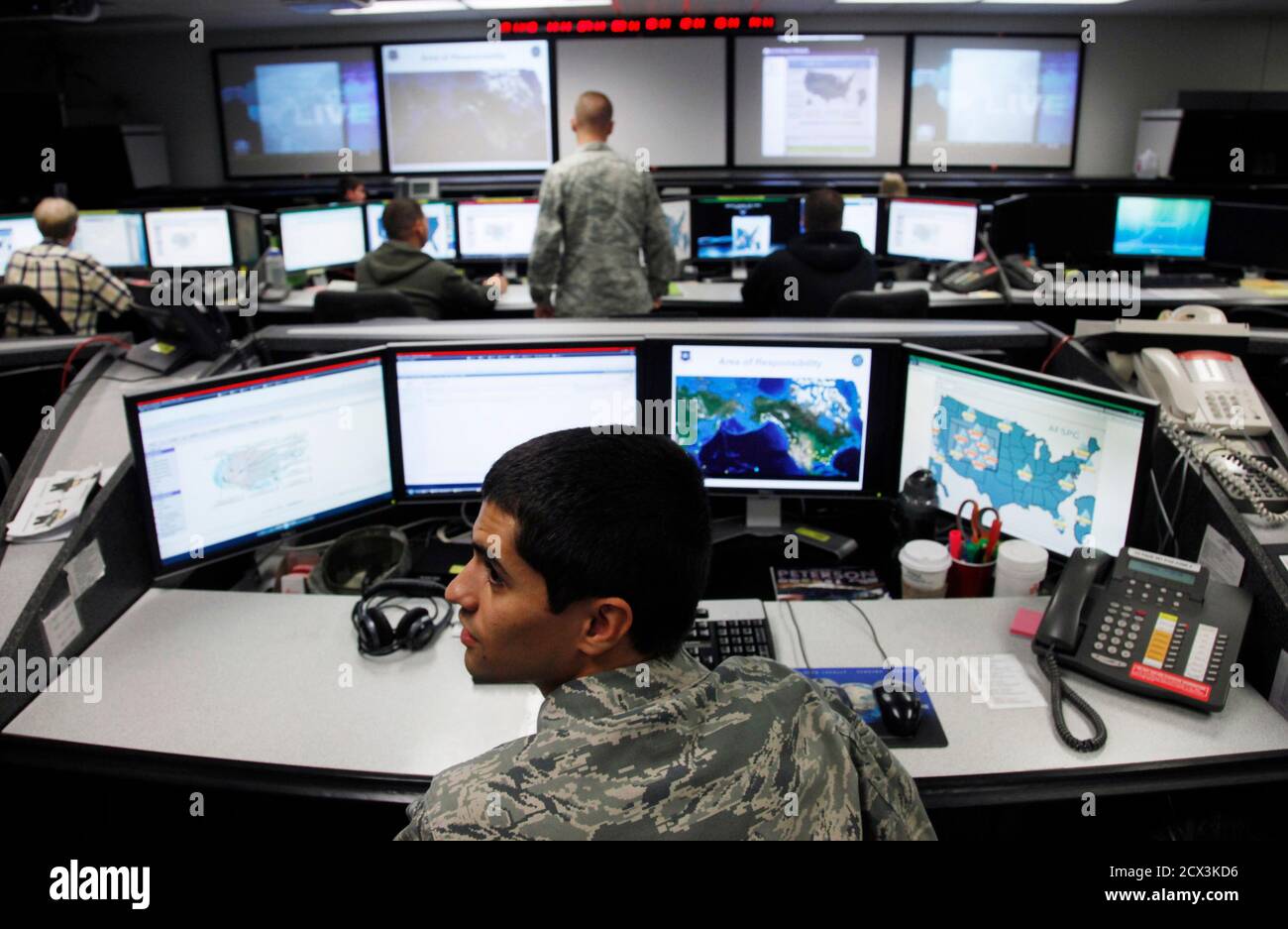 2Lt William Liggett works at the Air Force Space Command Network Operations & Security Center at Peterson Air Force Base in Colorado Springs, Colorado July 20, 2010. U.S. national security planners are proposing that the 21st century's critical infrastructure -- power grids, communications, water utilities, financial networks -- be similarly shielded from cyber marauders and other foes. The ramparts would be virtual, their perimeters policed by the Pentagon and backed by digital weapons capable of circling the globe in milliseconds to knock out targets.  To match Special Report  USA-CYBERWAR/  Stock Photo
