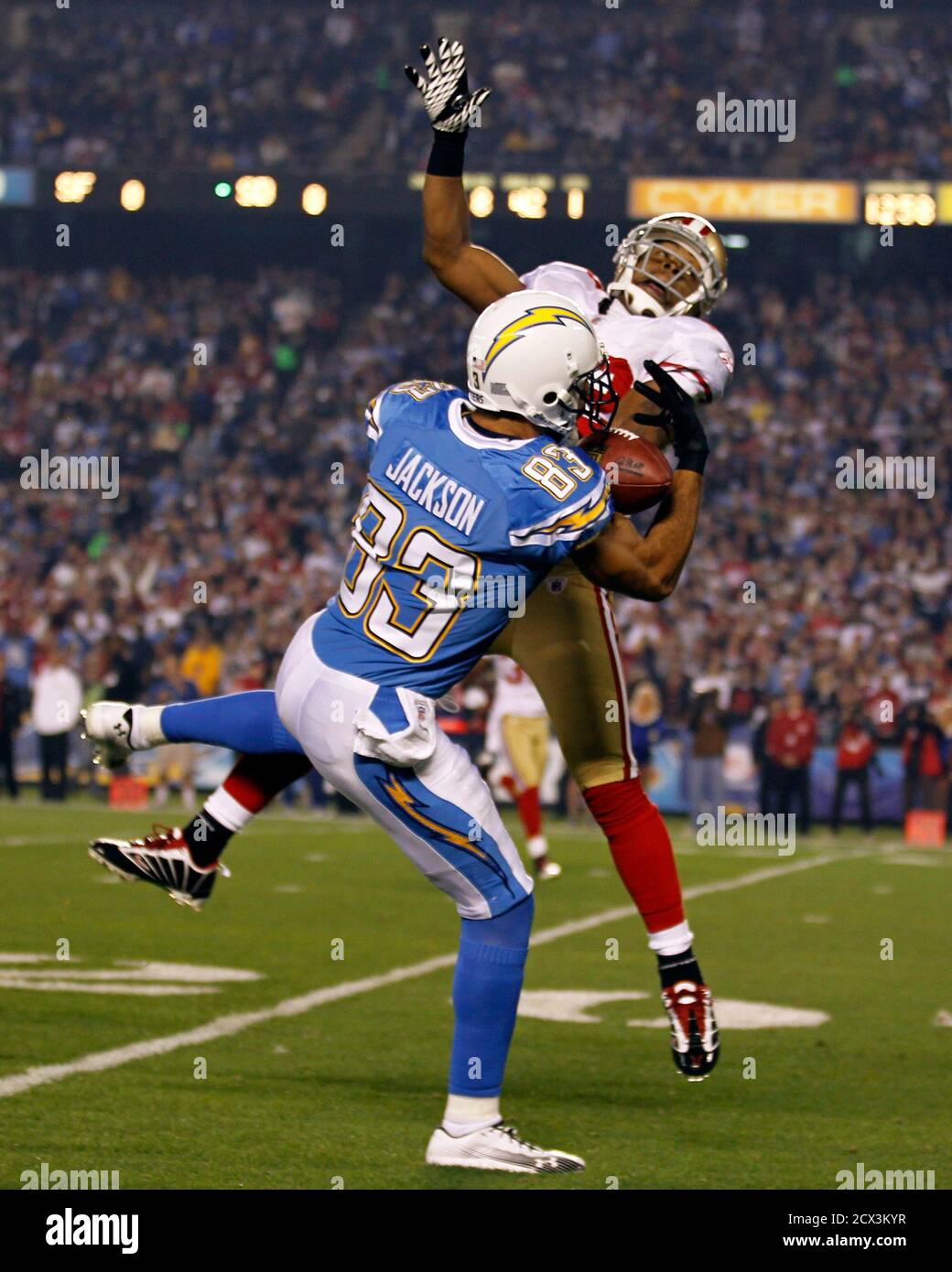 San Diego Chargers wide receiver Vincent Jackson (front) catches a pass that led to a touchdown as San Francisco 49ers cornerback Nate Clements tries to stop him during their NFL football game in San Diego, California December 16, 2010.    REUTERS/Mike Blake   (UNITED STATES - Tags: SPORT FOOTBALL IMAGES OF THE DAY) Stock Photo