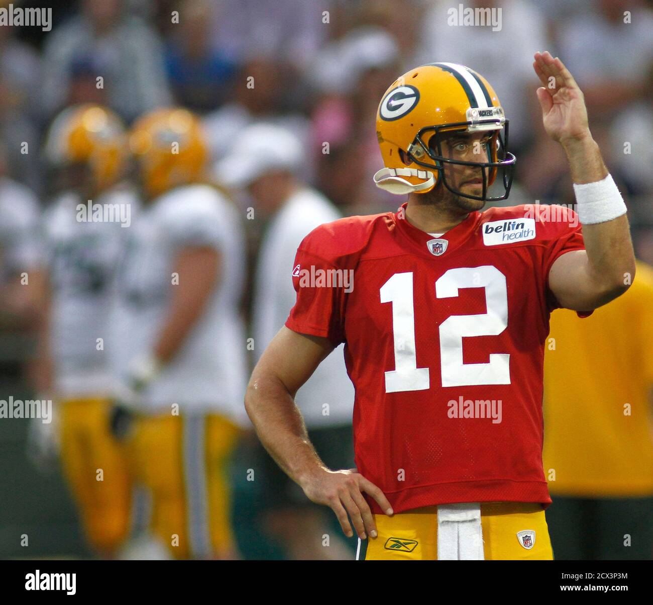 Super Bowl Champions Green Bay Packers' Aaron Rodgers signals to another  player during NFL training camp practice at the Ray Nitschke field in Green  Bay, Wisconsin August 1, 2011. REUTERS/Darren Hauck (UNITED