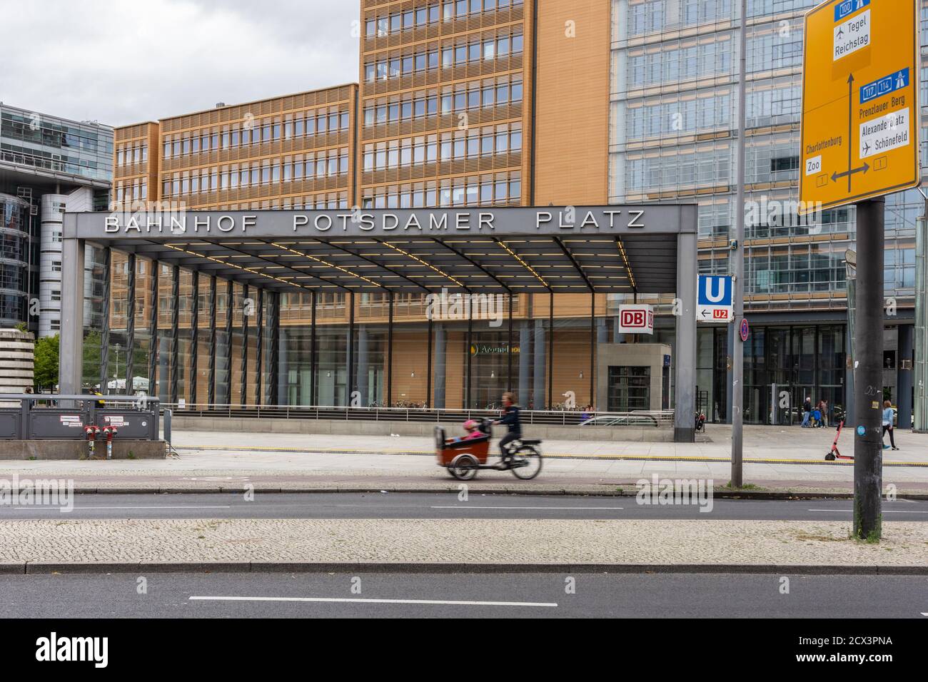 Potsdamer Platz station with cyclists and pedestrians Stock Photo - Alamy