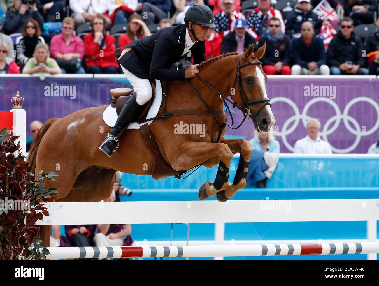 New Zealand's Andrew Nicholson, riding Nereo, clears a fence during the Eventing Jumping equestrian event at the London 2012 Olympic Games in Greenwich Park, July 31, 2012.    REUTERS/Mike Hutchings (BRITAIN  - Tags: SPORT OLYMPICS EQUESTRIANISM) Stock Photo