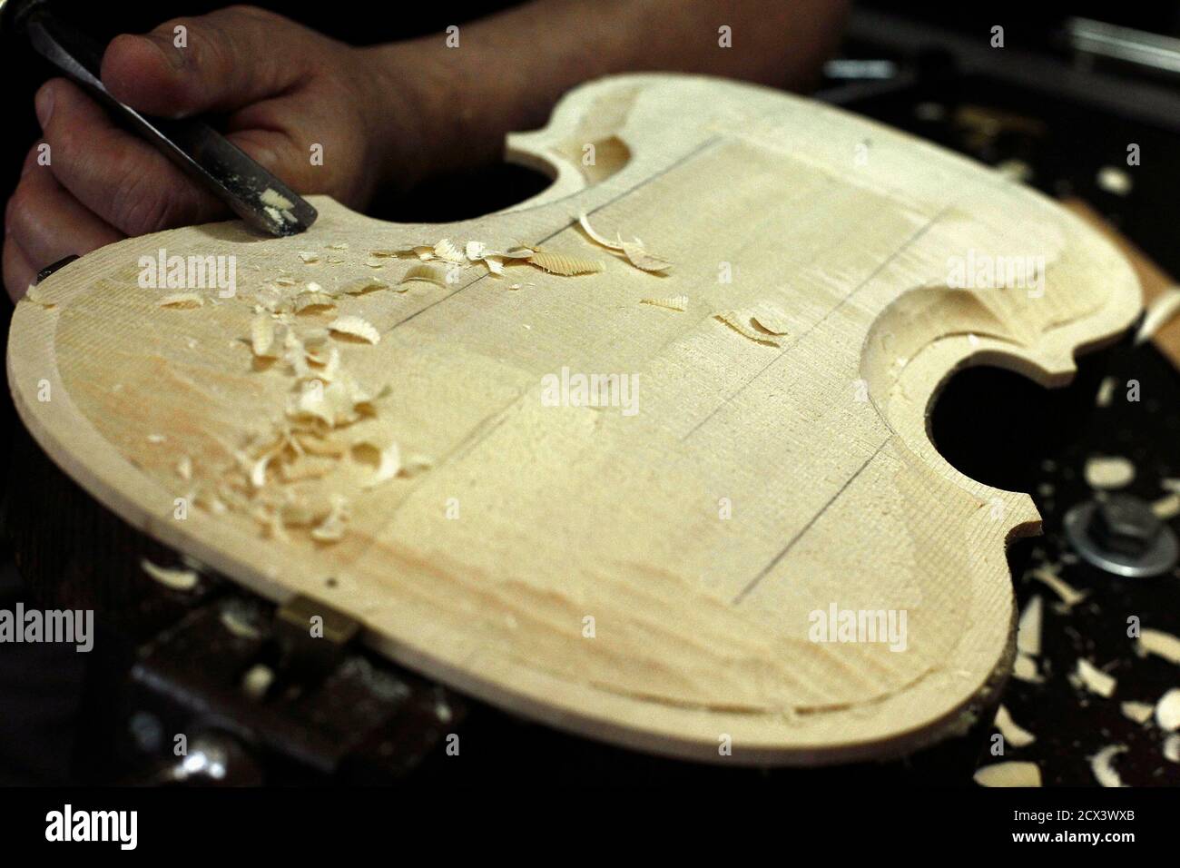 Jose Prada constructs a violin at his father's workshop in San Jose, August  10, 2012. Four generations of the Prada family have been involved in the  crafting and restoration of violins and