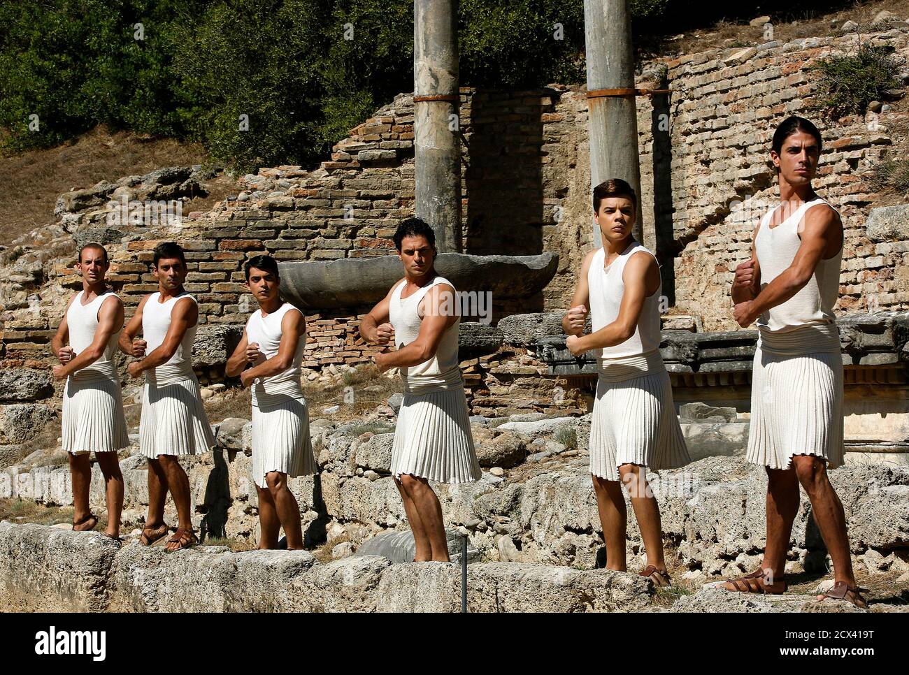 Greek men dressed in ancient robes perform a ceremonial dance during a dress rehearsal for the torch lighting ceremony of the Sochi 2014 Winter Olympic Games at the site of ancient Olympia Greek men dressed in ancient robes perform a ceremonial dance during a dress rehearsal for the torch lighting ceremony of the Sochi 2014 Winter Olympic Games at the site of ancient Olympia