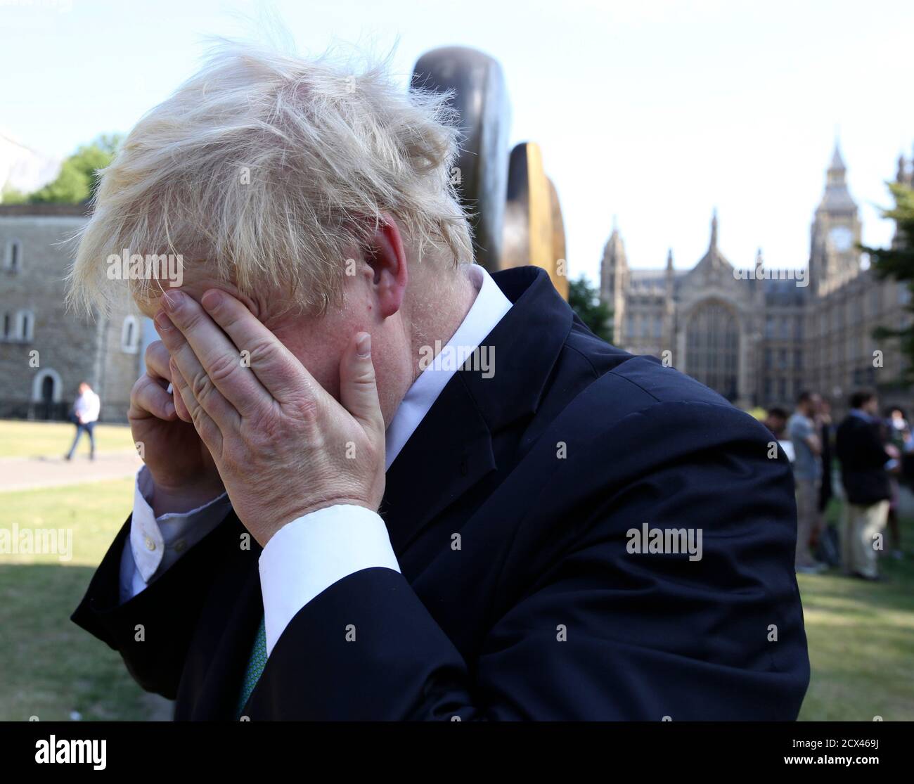 London Mayor Boris Johnson speaks on the phone as he gathers with other MPs who oppose the expansion of Heathrow airport, in central London, Britain July 1, 2015.  Johnson dismissed a proposal on Wednesday to expand Heathrow Airport as undeliverable and piled pressure on Prime Minister David Cameron to reject the plan, setting the scene for a protracted political dispute. The government-appointed Airports Commission earlier recommended a third runway be built at Heathrow to add urgently required capacity, proposing a package of measures to mitigate the noise and environmental impact.  REUTERS/ Stock Photo