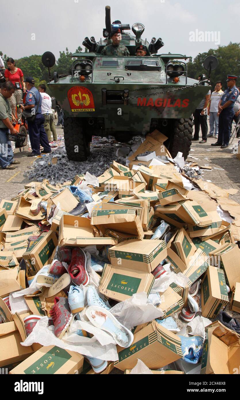 skinke Maryanne Jones Forberedende navn An armoured personnel carrier (APC) of the Philippine National Police  destroys pirated DVDs, counterfeit bags, shoes and eyewear in a police camp in  Quezon city, Metro Manila June 30, 2011. Pirated goods