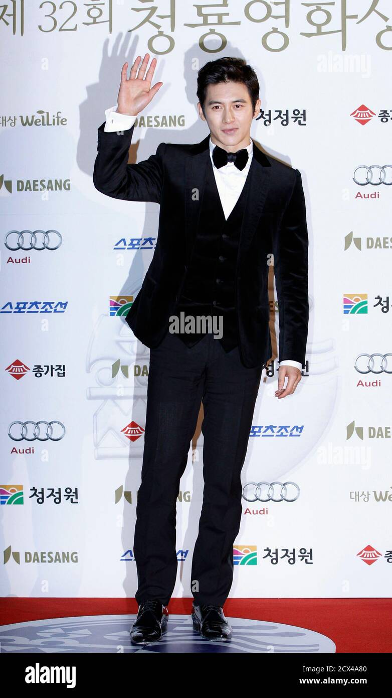 South Korean actor Kosoo poses for photographs before the Blue Dragon Film Awards in Seoul November 25, 2011. REUTERS/Jo Yong-Hak (SOUTH KOREA - Tags: ENTERTAINMENT) Stock Photo
