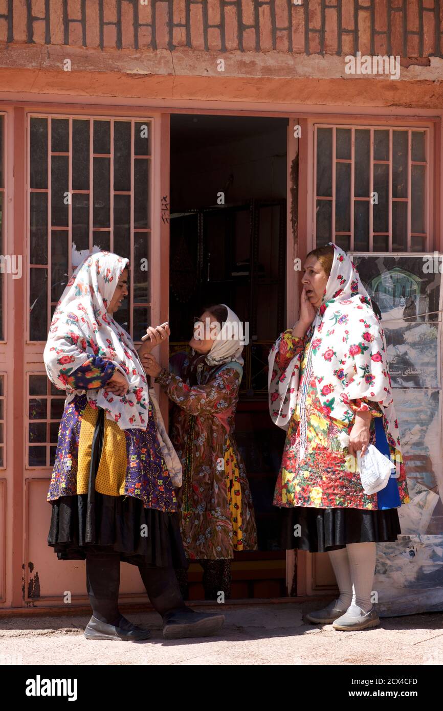 Local Abyanaki women in conversation. Abyaneh village, Barzrud Rural District, Isfahan Province, Iran Stock Photo
