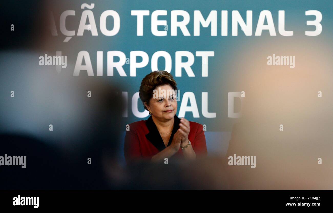 Brazilian President Dilma Rousseff gestures as she attends the inauguration of Terminal 3 at Guarulhos International airport in Sao Paulo May 20, 2014. The new terminal includes 20 departure gates, a runway with a capacity for 34 aircraft, and is expected to receive 12 million passengers each year. REUTERS/Paulo Whitaker (BRAZIL - Tags: SPORT SOCCER WORLD CUP TRANSPORT POLITICS) Stock Photo
