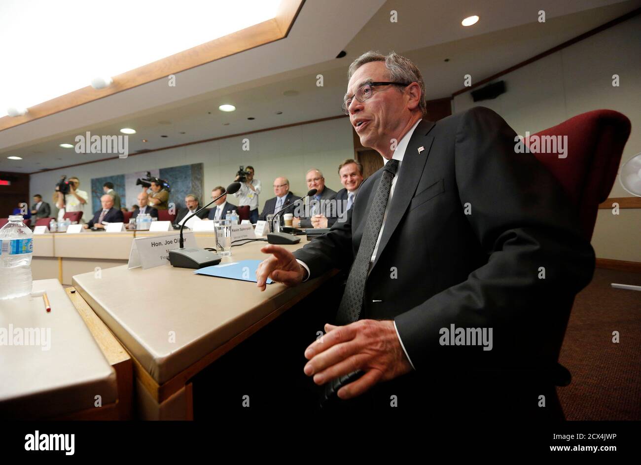 Canada's Finance Minister Joe Oliver (R) meets with private sector economists in Ottawa June 16, 2014. REUTERS/Chris Wattie (CANADA - Tags: POLITICS BUSINESS) Stock Photo