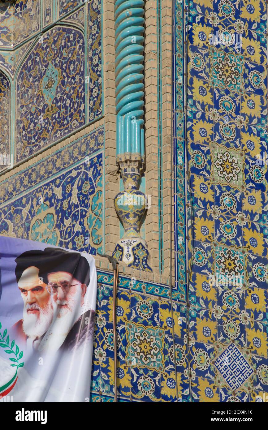 Supreme Leaders of the Islamic Revolution,  Ayatollah Ali Khamenei and Ruhollah Ruhollah Khomeini on a banner. Imam Architectural Detail. Stock Photo