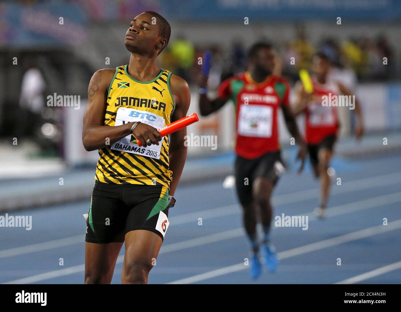 Jamaica's Warren Weir reacts as he crosses the finish line as Jamaica