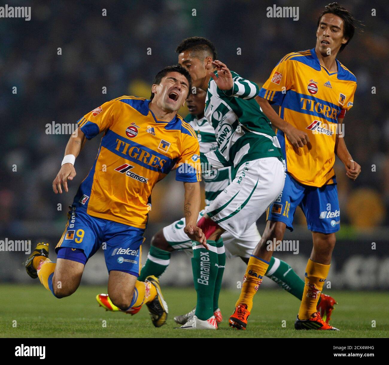 Tigres Hector Mancilla L Is Fouled By Santos Jose Maria Cardenas 2nd R During Their Mexican League Championship Final First Leg Soccer Match At The Tsm Corona Stadium In Torreon December 8