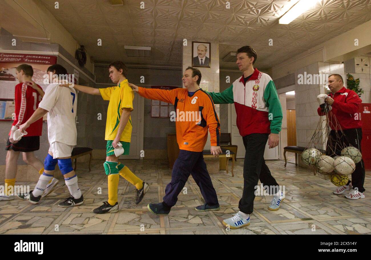 Men who are blind or visually impaired, walk before a futsal training  session in Vitebsk, some