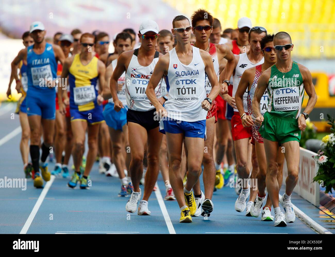 Matej Toth of Slovakia (C) and Robert Heffernan of Ireland (R) lead the  pack at the start of the men's 50 km race walk final during the IAAF World  Athletics Championships at