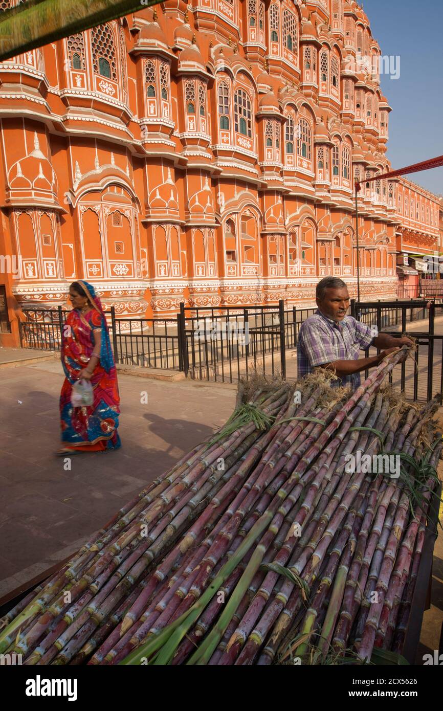 Indian street vendor outside the Hawa Mahal selling sugar cane during