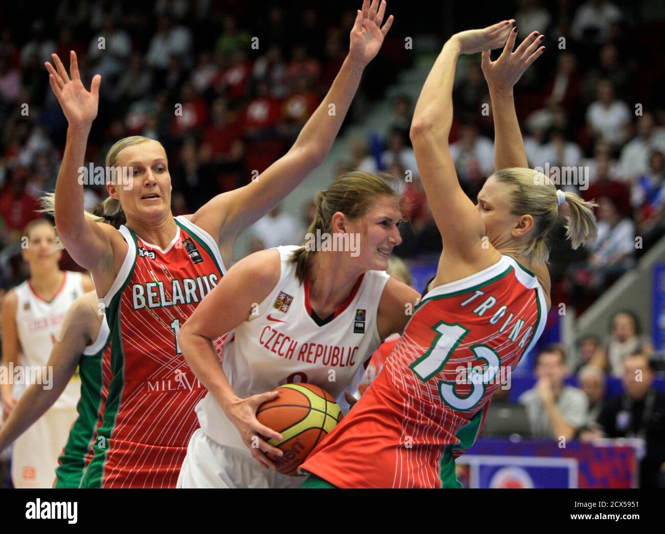 Ilona Burgrova (C) of the Czech Republic tries to pass between Yelena  Leuchanka (L) and Tatyana Troina of Belarus during their FIBA women's World  Basketball Championship semi-final game in Karlovy Vary October
