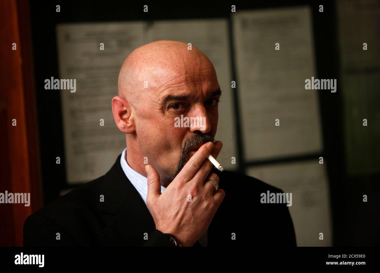 praise smoke mow Romanian Nicolae Popa smokes a cigarette as wait he waits for his  deportation trial at a south Jakarta court November 29, 2010. Popa was  convicted in absentia for defrauding more than 100,000
