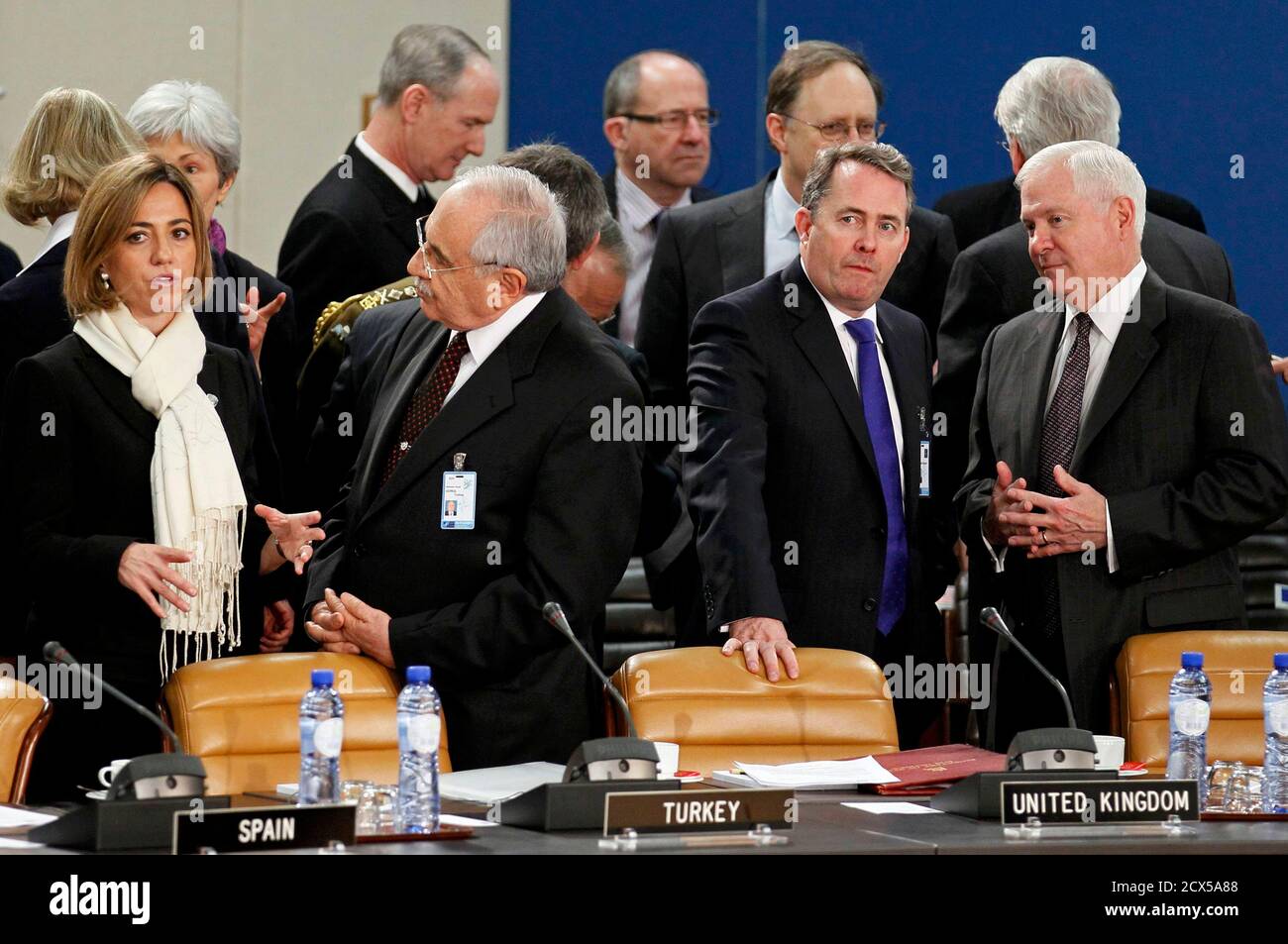 (L-R) Spain's Defence Minister Carme Chacon, her Turkish counterpart Vecdi Gonul , Britain's Defence Secretary Liam Fox and U.S. Defense Secretary Robert Gates attend a NATO defence ministers meeting (NAC) at the Alliance headquarters in Brussels March 10, 2011. NATO defence ministers meeting in Brussels on Thursday and Friday will discuss options to respond to the turmoil in Libya, including a possible no-fly zone, the officials said.      REUTERS/Yves Herman (BELGIUM - Tags: POLITICS CIVIL UNREST MILITARY IMAGES OF THE DAY) Stock Photo