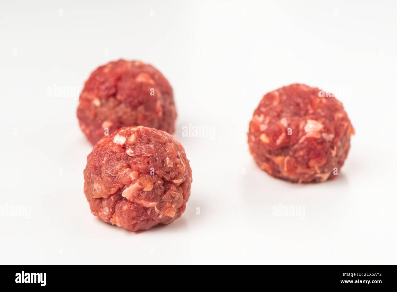Raw beef meatballs on white background Stock Photo
