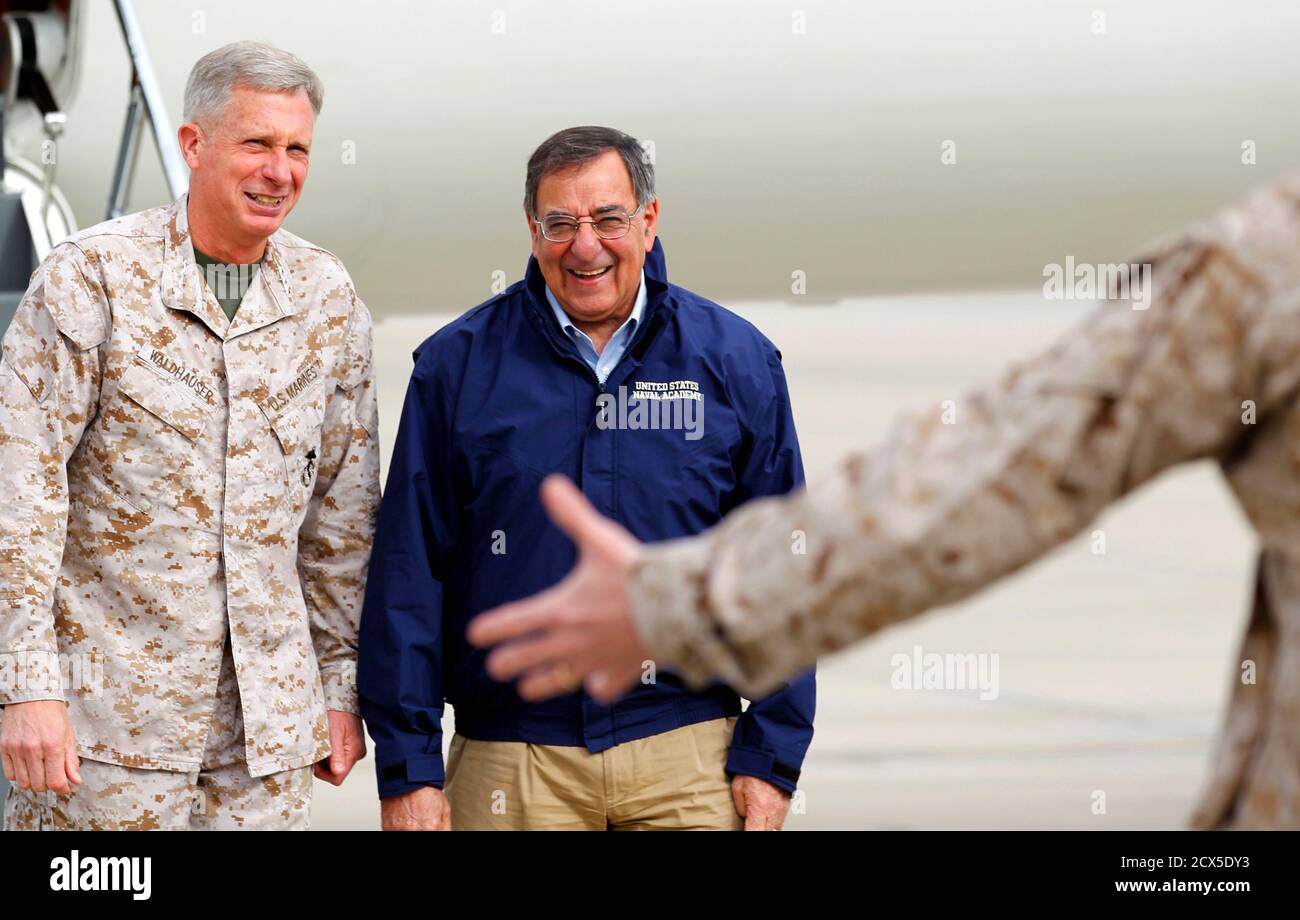 U.S. Secretary of Defense Leon Panetta (C) stands next to Lt. General Thomas Waldhauser of 1st Marine Expeditionary Force as he is greeted upon his arrival at Camp Pendleton March 30, 2012.   REUTERS/ Mike Blake    (UNITED STATES - Tags: MILITARY POLITICS) Stock Photo