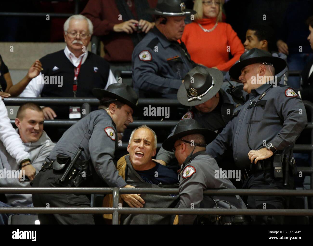 U.S. President Barack Obama is interrupted by an anti-abortion protester as he speaks at a campaign event at Fifth Third Arena at the University of Cincinnati, November 4, 2012. Police carried the man away in handcuffs.         REUTERS/Larry Downing  (UNITED STATES - Tags: POLITICS USA PRESIDENTIAL ELECTION ELECTIONS) Stock Photo