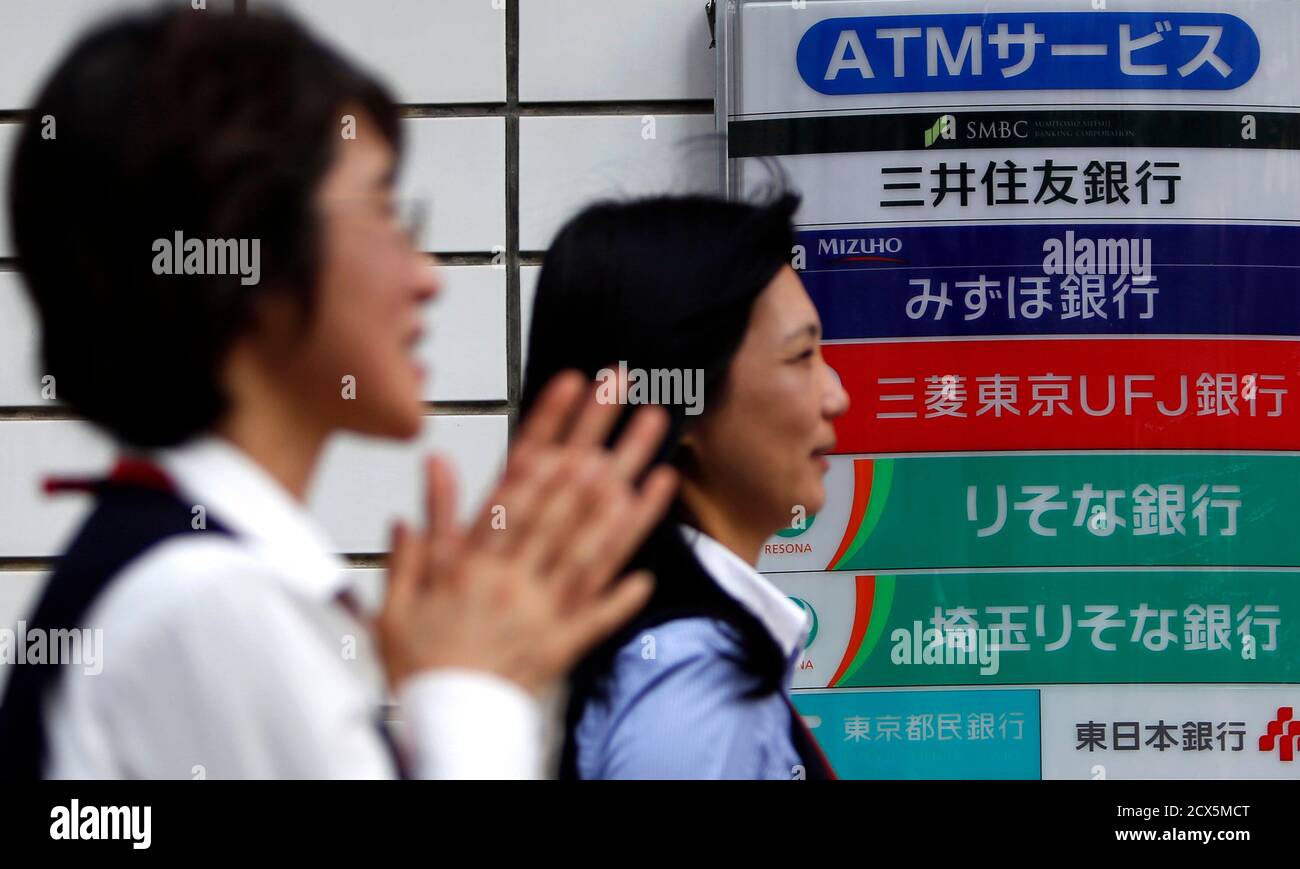 https www alamy com pedestrians walk past a signboard of japans three mega banks sumitomo mitsui banking corporation 2nd top mizuho bank 3rd top and bank of tokyo mitsubishi ufj in tokyo february 3 2014 japans biggest banks flush with cash from a year long stock market rally are poised to benefit this year from a spurt in loan growth at home fuelled by the economic stimulus measures of prime minister shinzo abe reutersyuya shino japan tags business image377524584 html