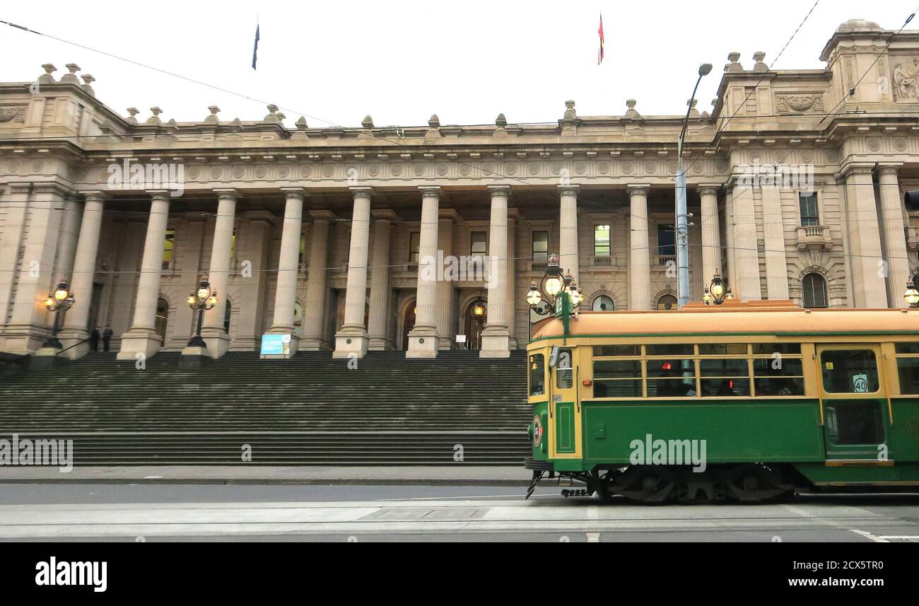 Melbourne Australia; Heritage views, a historic W-Class tram rolls past the historic Parliament House in Melbourne . Stock Photo