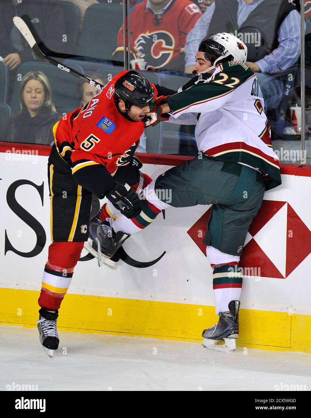 Calgary Flames Mark Giordano L Hits Minnesota Wild S Cal Clutterbuck During The First Period Of Their