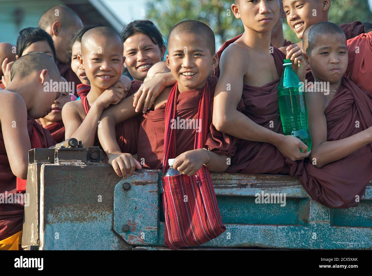 Burmese buddhist novice monks travelling together in the back of a truck during water festival celebrations, Kalaw, Burma Stock Photo