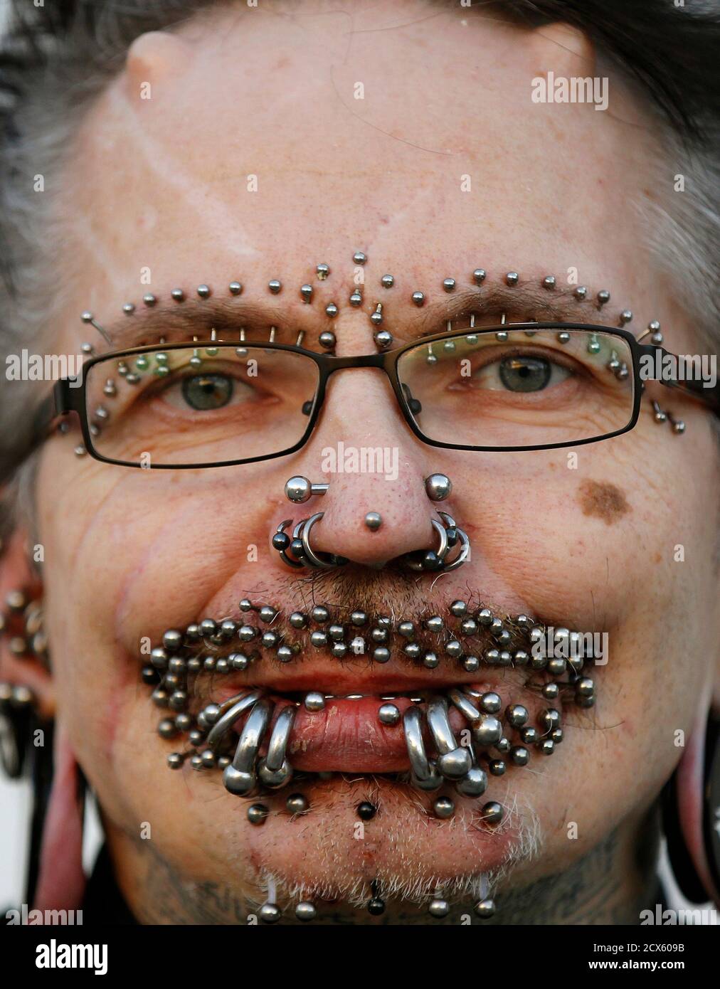 Guinness World Record holder for the 'Most Pierced Man', Rolf Bucholz of  Germany, poses showing some of his 453 piercings in Dortmund, October 24,  2011. REUTERS/Ina Fassbender (GERMANY - Tags: SOCIETY ENTERTAINMENT