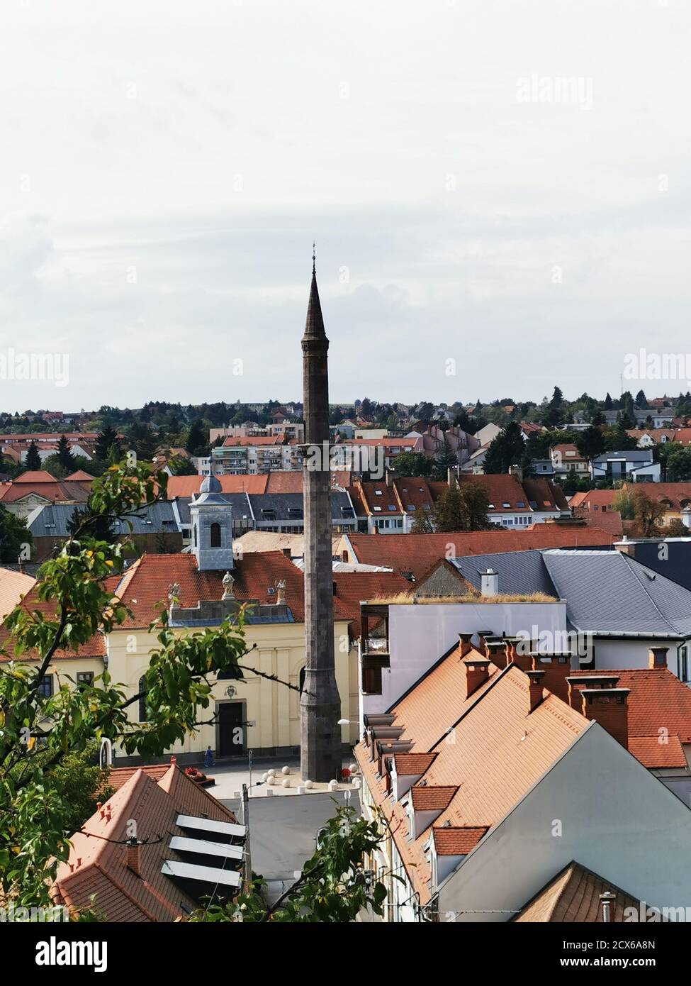 Vertical cityscape view with traditional red-tiled buildings in Eger, Hungary Stock Photo