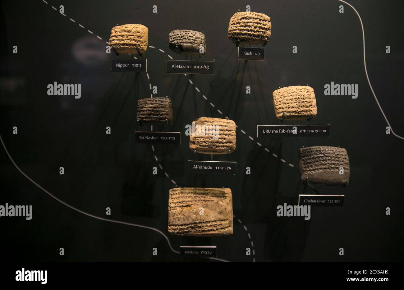 Cuneiform tablets are displayed during an exhibition at the Bible Lands Museum in Jerusalem, February 3, 2015. The exhibition of ancient clay tablets from modern-day Iraq is shedding light for the first time on the daily lives of Jews who were exiled to Babylon from Jerusalem some 2,500 years ago.The exhibition is based on more than 100 cuneiform tablets, each no bigger than an adult's palm, that detail transactions and contracts between Judeans driven out of or convinced to move from Jerusalem by King Nebuchadnezzar in 600 BC. REUTERS/Baz Ratner (JERUSALEM - Tags: SOCIETY) Stock Photo