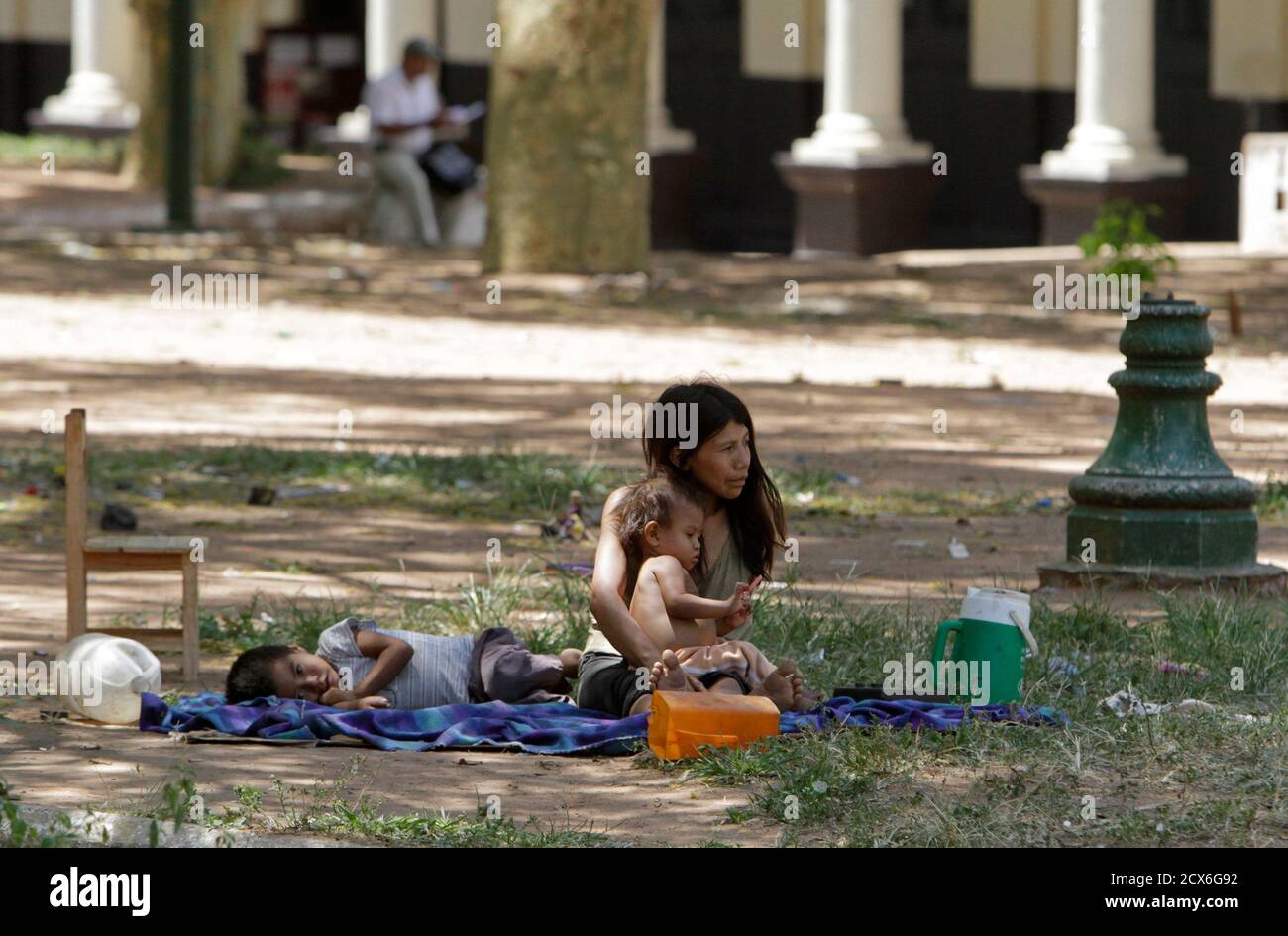 A Guarani Indian Family Rests At The Plaza Uruguay Square Where They Have Been Camping For The Past Seven Months In Asuncion January 3 2012 According To Organisers More Than 380 Families