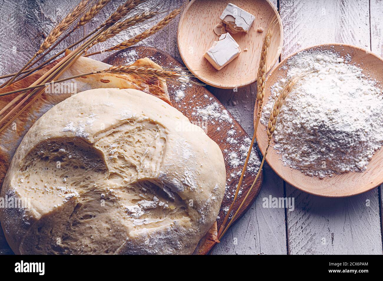 Fermented bread with spikes of wheat, flour and yeast. Traditional