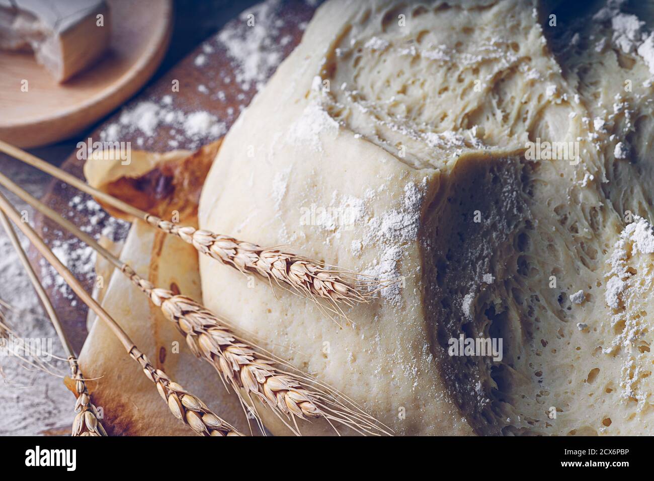 Fermented bread with spikes of wheat, flour and yeast. Traditional