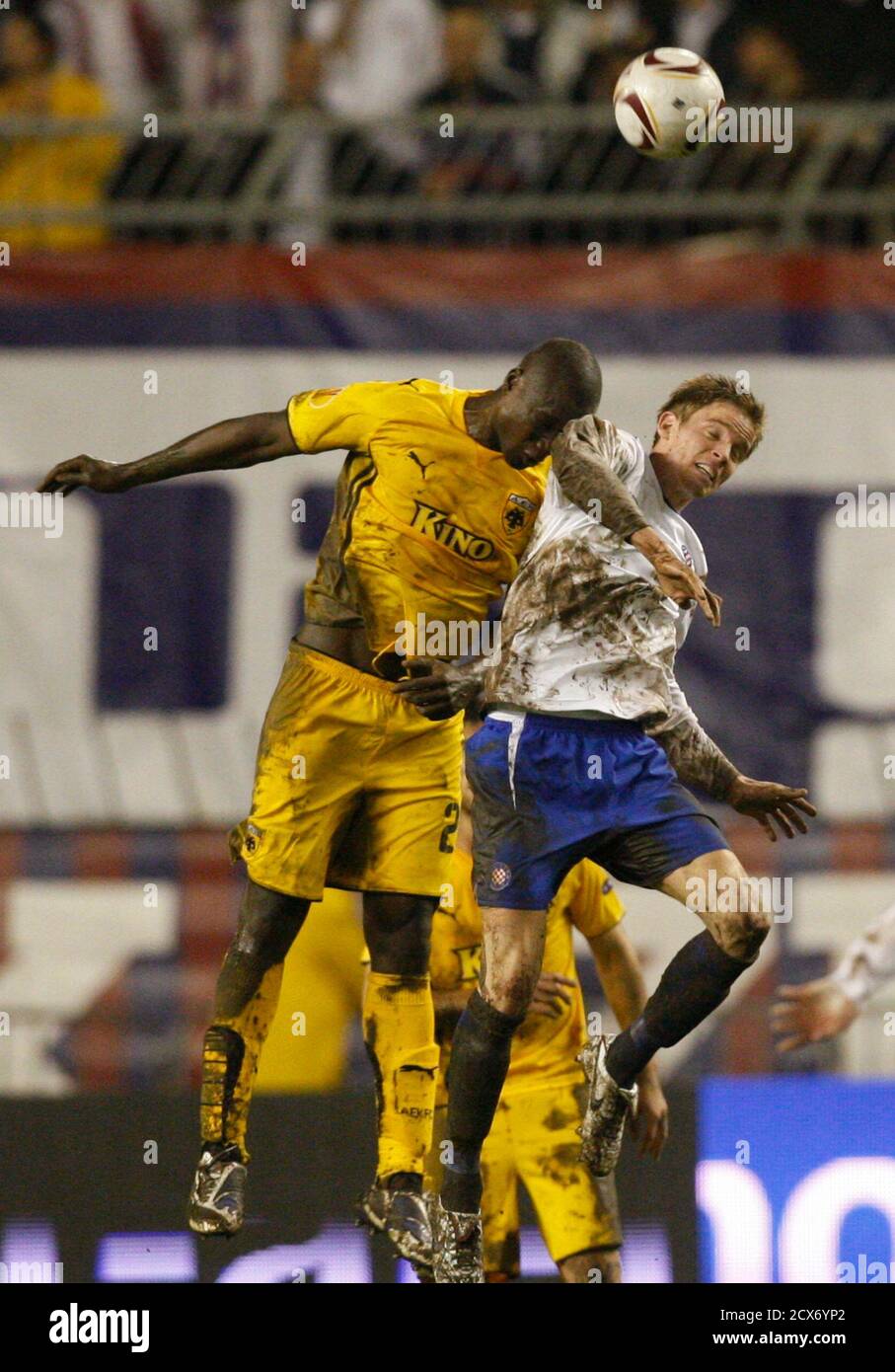 Papa Bouba Diop of AEK (L) challenges Marin Tomasov of Hajduk during their  Europa League Group G soccer match at the Poljud stadium in Croatia's  Adriatic port of Split December 1, 2010.