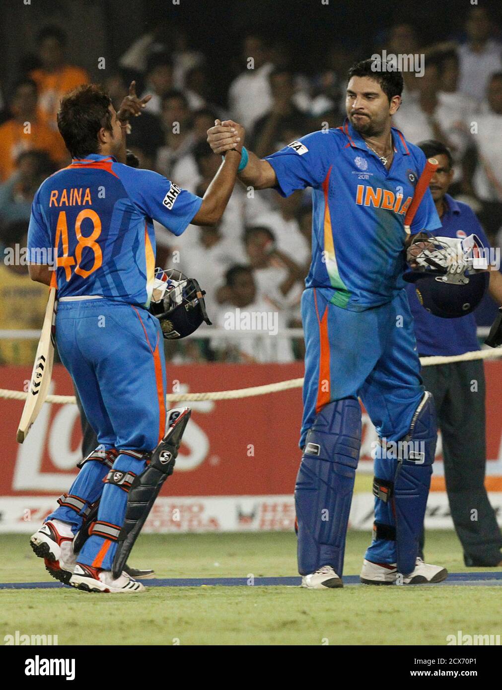 India's Suresh Raina (L) celebrates with teammate Yuvraj Singh after winning their Cricket World Cup 2011 quarter-final match against Australia in Ahmedabad March 24, 2011. REUTERS/Amit Dave (INDIA - Tags: SPORT CRICKET India's Suresh Raina (L) celebrates with teammate Yuvraj Singh after winning their Cricket World Cup 2011 quarter-final match against Australia in Ahmedabad March 24, 2011. REUTERS/Amit Dave (INDIA - Tags: SPORT CRICKET