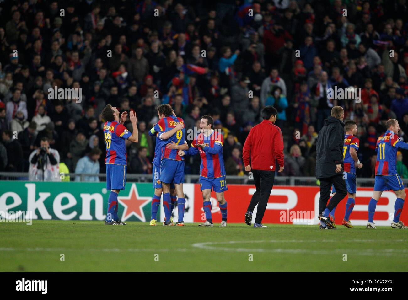FC Basel (FCB) players including (L-R) David Abraham, Marco Streller and  Alexander Frei celebrate at the end of their Champions League Group C  soccer match against Manchester United in Basel, December 7,