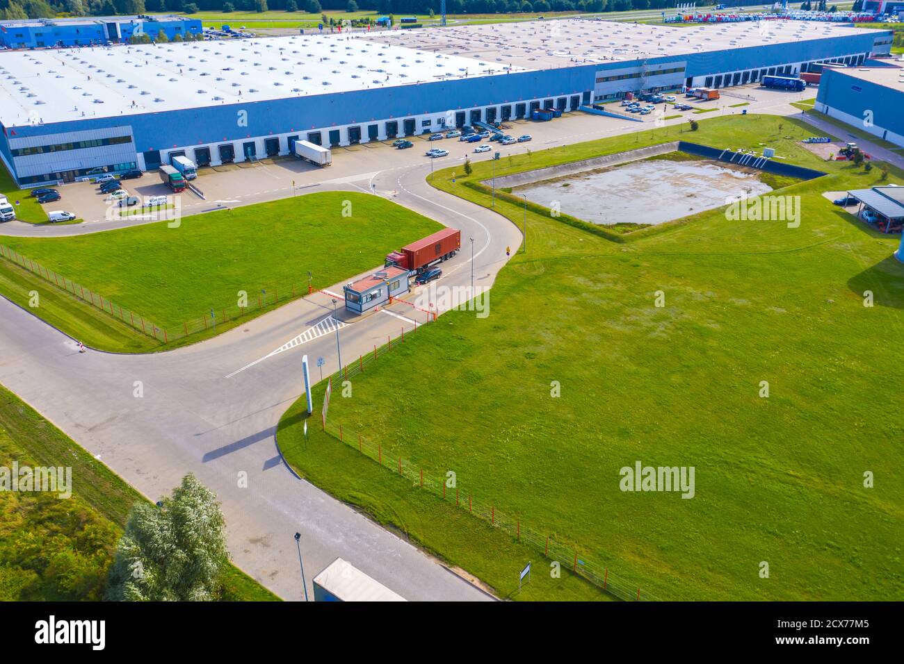 Aerial Shot of Industrial Loading Area where Many Trucks Are Unloading ...