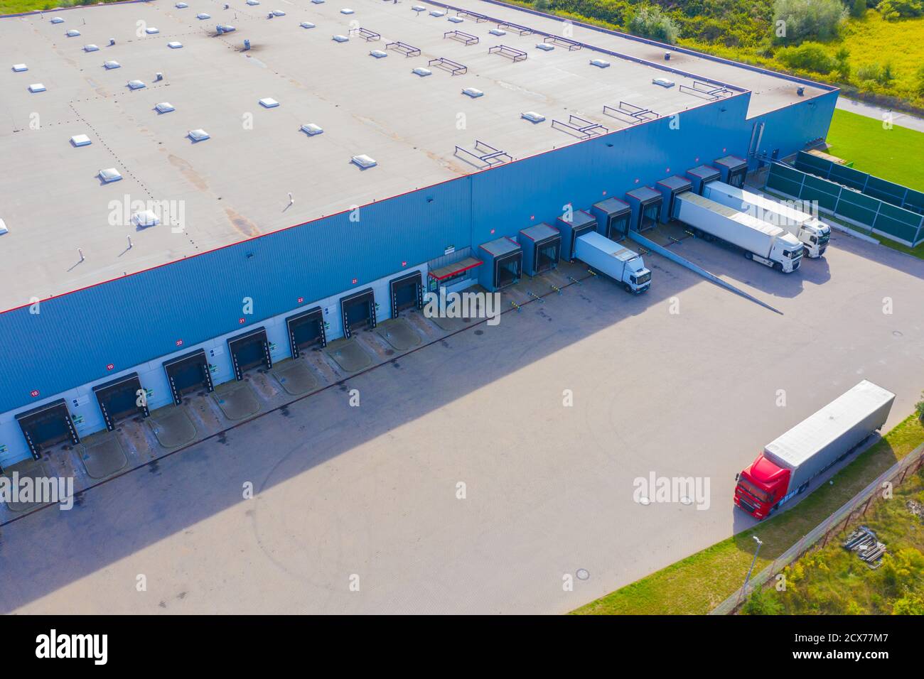 Aerial Shot of Industrial Loading Area where Many Trucks Are Unloading ...