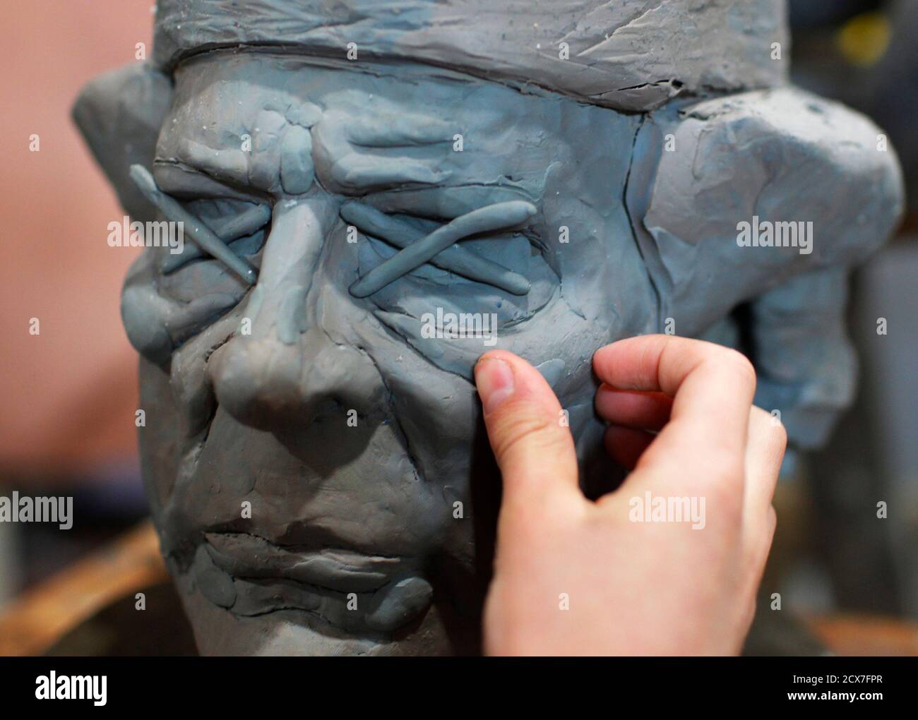 Rodman Edwards 11 Year Old Son Of Artist Daniel Edwards Works On His Father S Sculpture Knut Watches Over Germany Which Features Germany S Beloved Polar Bear Knut Sitting On Libyan Leader Muammar Gaddafi S Head At