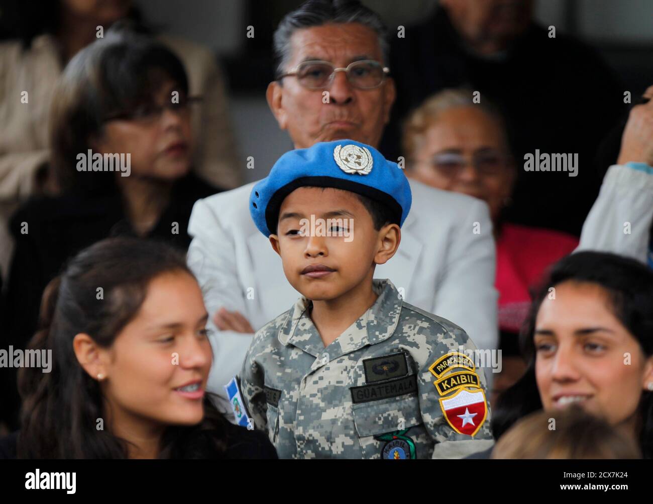 A Child Dressed As A Guatemalan Soldier Attends A Ceremony Before The Departure Of Members Of Special Force Group Molusco To The Democratic Republic Of Congo At Military Base Mariscal Zavala In
